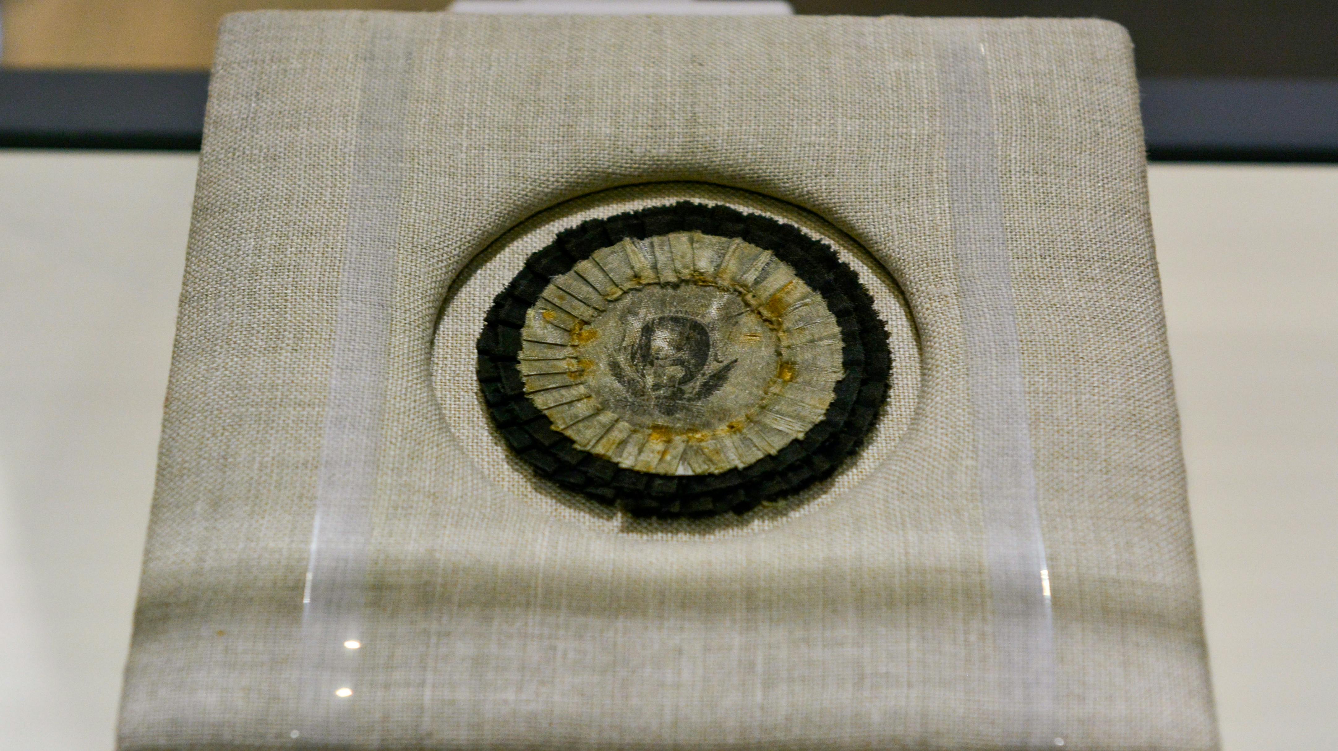 This cockade bears the likeness of Lafayette in the center.