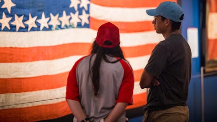 couple looking at a flag in the Flags and Founding Documents Exhibit