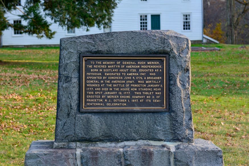 This image shows a plaque on a stone at Princeton Battlefield that is dedicated to the memory of General Hugh Mercer who was killed at the battle.