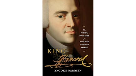Book cover for King Hancock book featuring a large portrait of John Hancock's face with the title King Hancock in gold and Hancock written in his famous signature.