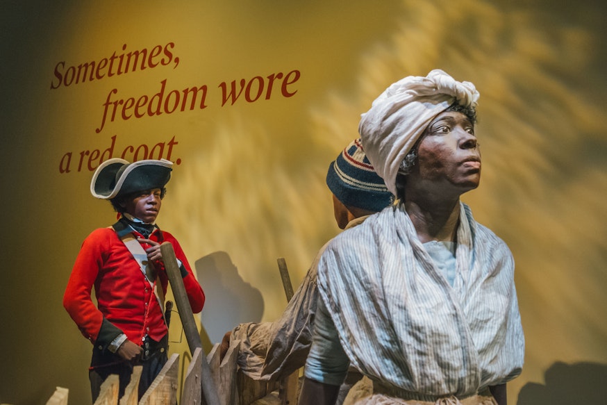 Finding Freedom tableau scene at the Museum depicting a British soldier of African descent trying to recruit a young boy of African descent to find freedom with the British army.