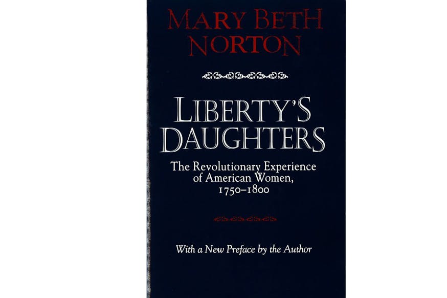 The image shows the book cover of Liberty's Daughters: The Revolutionary Experience of American Women, 1750-1800 by Mary Beth Norton. It is a blue cover with Mary’s name written in red font at the top of the image. The title of the book is written in white font in the middle of the image.