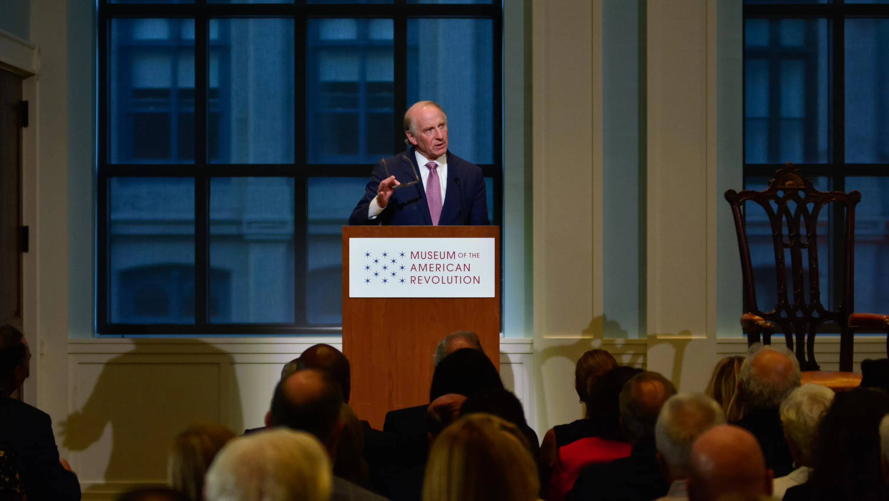 Richard Haass lectures at a podium