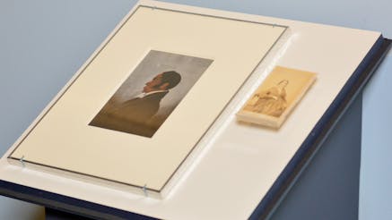 A painted portrait of James Forten is installed next to a small photograph of his wife Charlotte Vandine Forten in the Museum's Black Founders exhibit.