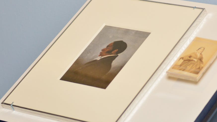 A painted portrait of James Forten is installed next to a small photograph of his wife Charlotte Vandine Forten in the Museum's Black Founders exhibit.