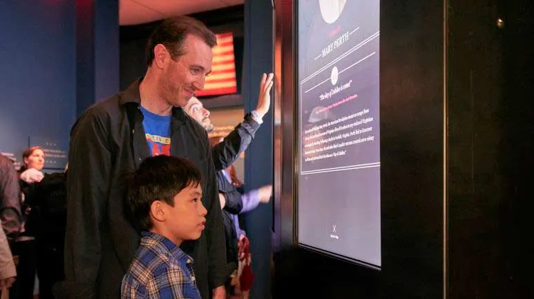 Adult and child at a museum exhibit