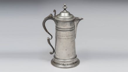 This image shows Reverend George Whitefield’s flagon. It is silver with an engraving reading “Rev. George Whitefield, Tabernacle, Bristol.” It is displayed against a white background.