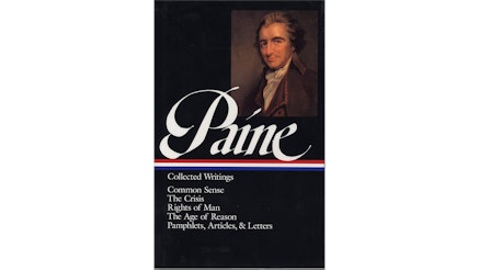 This image depicts the book cover of Thomas Paine Collected Writings. It includes Common Sense, The Crisis, Rights of Man, The Age of Reason, and other pamphlets, articles, and letters. It is a black background with an image of Paine in the top right corner. He is wearing a brown suit against a brown background and looking at the viewer. Paine is written in large white letters with the colors of the American flag in strips under the text.