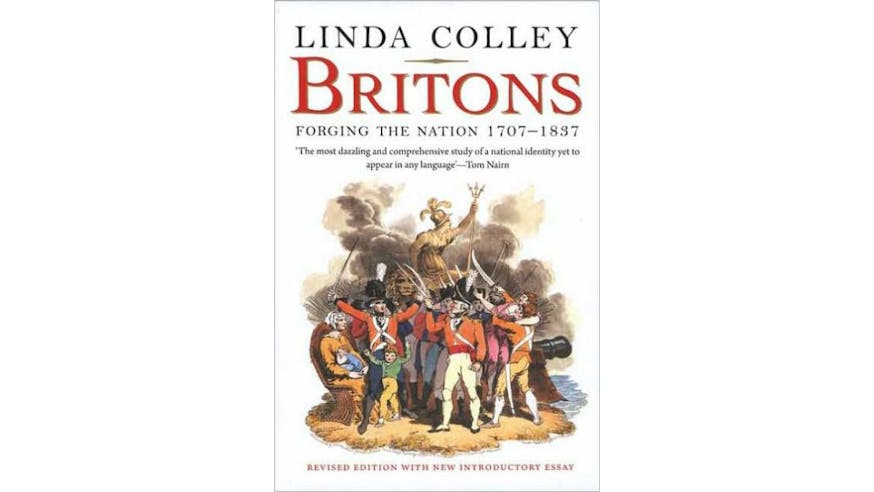 This image shows the book cover of Britons: Forging the Nation 1707-1837 by Linda Colley. There is a white background and Britons is written in red font. The rest of the text is black font. They are at the to of the page. There is an illustration of soldiers, women, and children standing on sand in the middle of a body of water. There are smoke clouds filling the air. There is a cannon on the right side of the image pointing outward toward the water. Many of the soldiers are holding this swords pointing upward.
