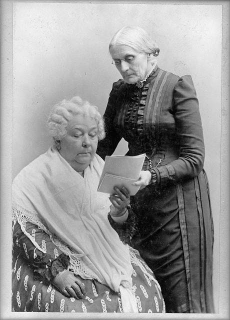 Photo of Elizabeth Cady Stanton, Seated, and Susan B. Anthony, Standing