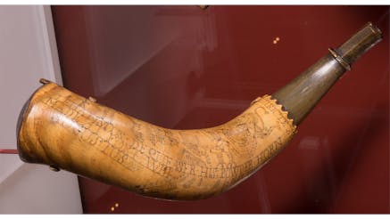 Fort William Augustus Powder Horn in the Museum of the American Revolution's Price of Victory gallery.