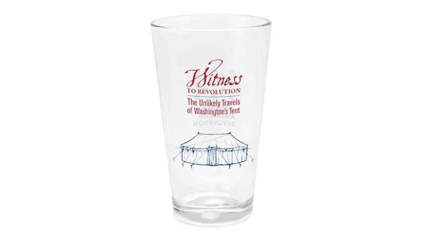 A pint glass with the exhibit title words Witness to Revolution The Unlikely Travels of Washington's Tent in red and a sketch of Washington's tent in blue.
