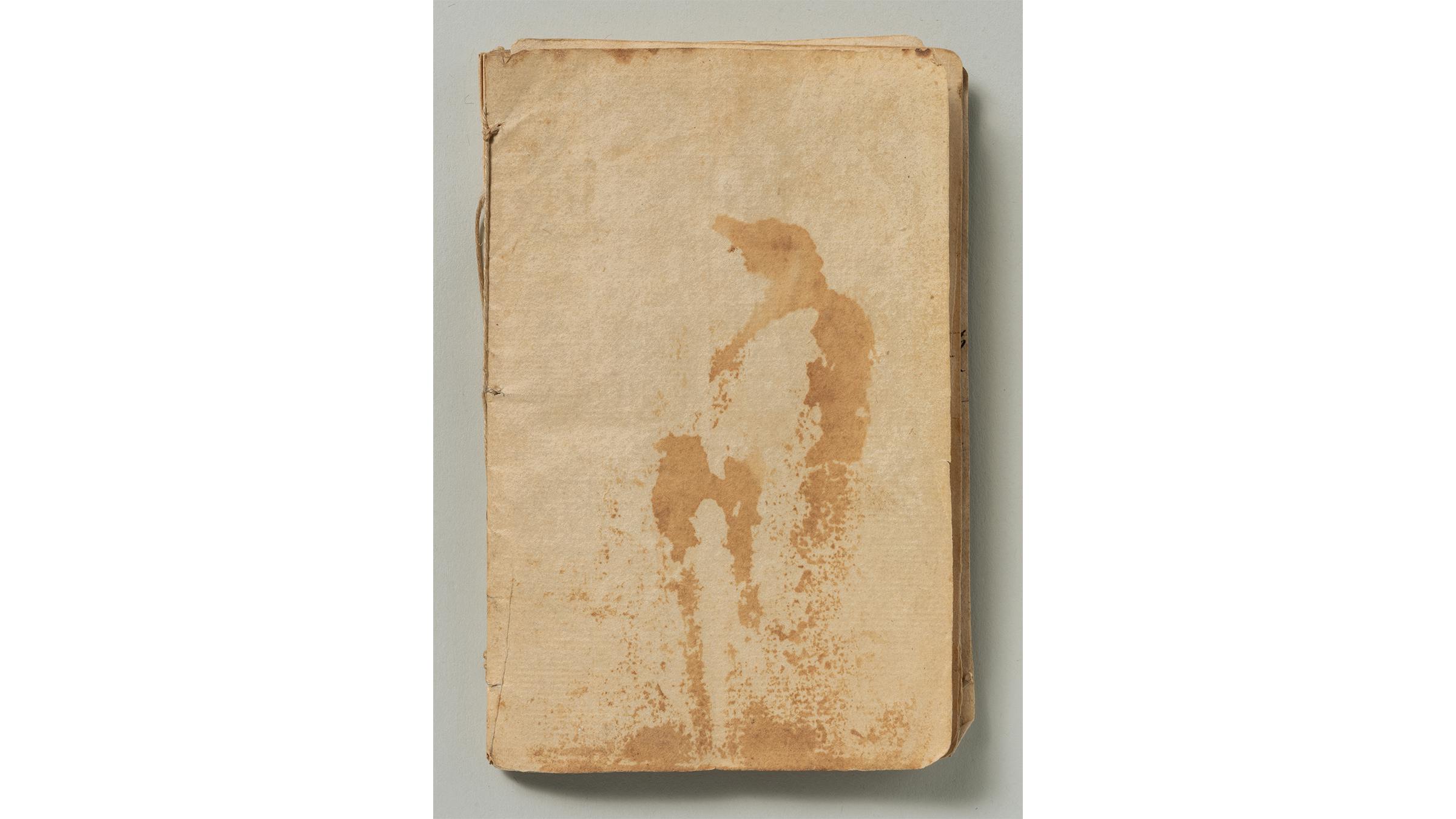 Small bound book missing its cover