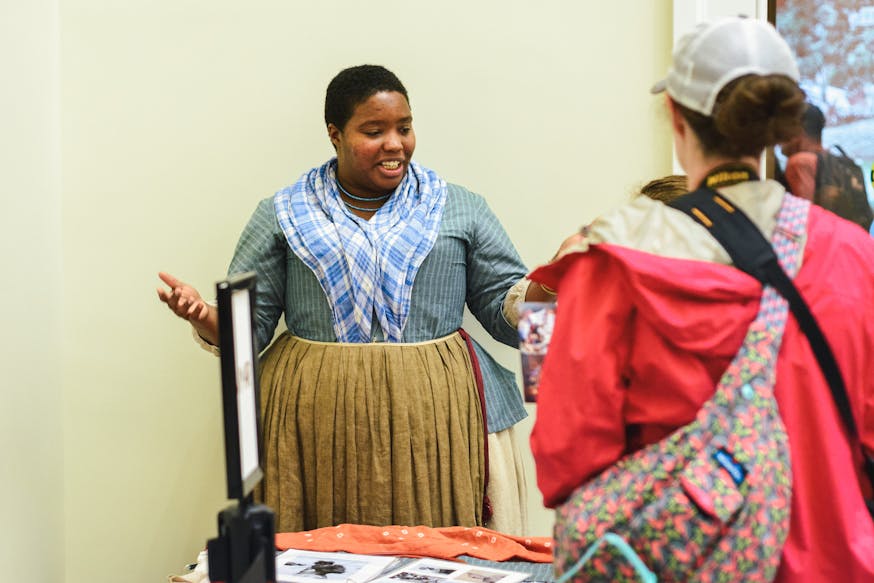 Cheyney Mcknight interacts with Museum guests as part of 2019 Meet The Revolution programming.