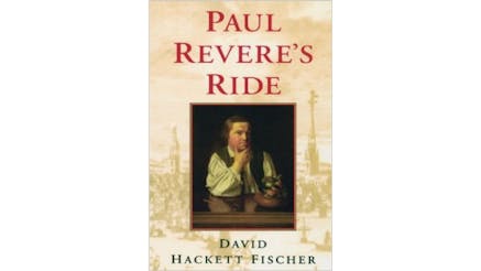 This image depicts the book cover of Paul Revere’s Ride by David Hackett Fischer. An image of Paul Revere is the focal point of the book cover. He is seated at a desk, with his firth hand on his chin and his elbow on the table looking quizzingly at the viewer.