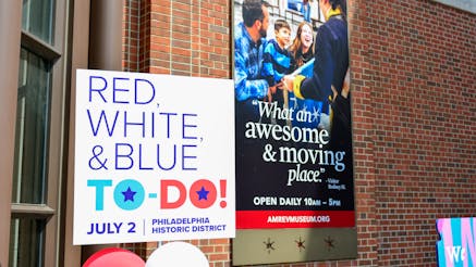 A sign that reads Red, White, & Blue To-Do in front of the Museum's facade