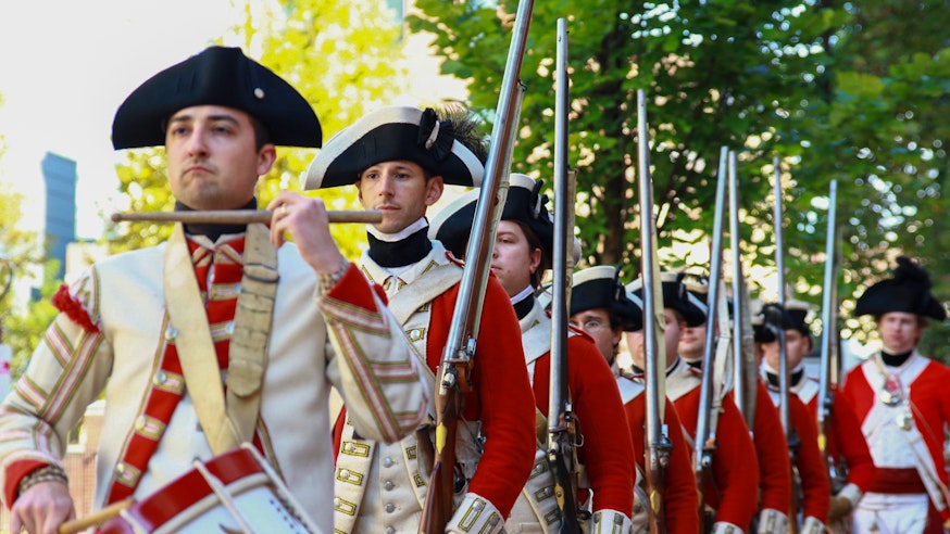 British soldiers march towards the Museum led by a drummer as part of the Museum's Occupied Philadelphia living history event in 2019.