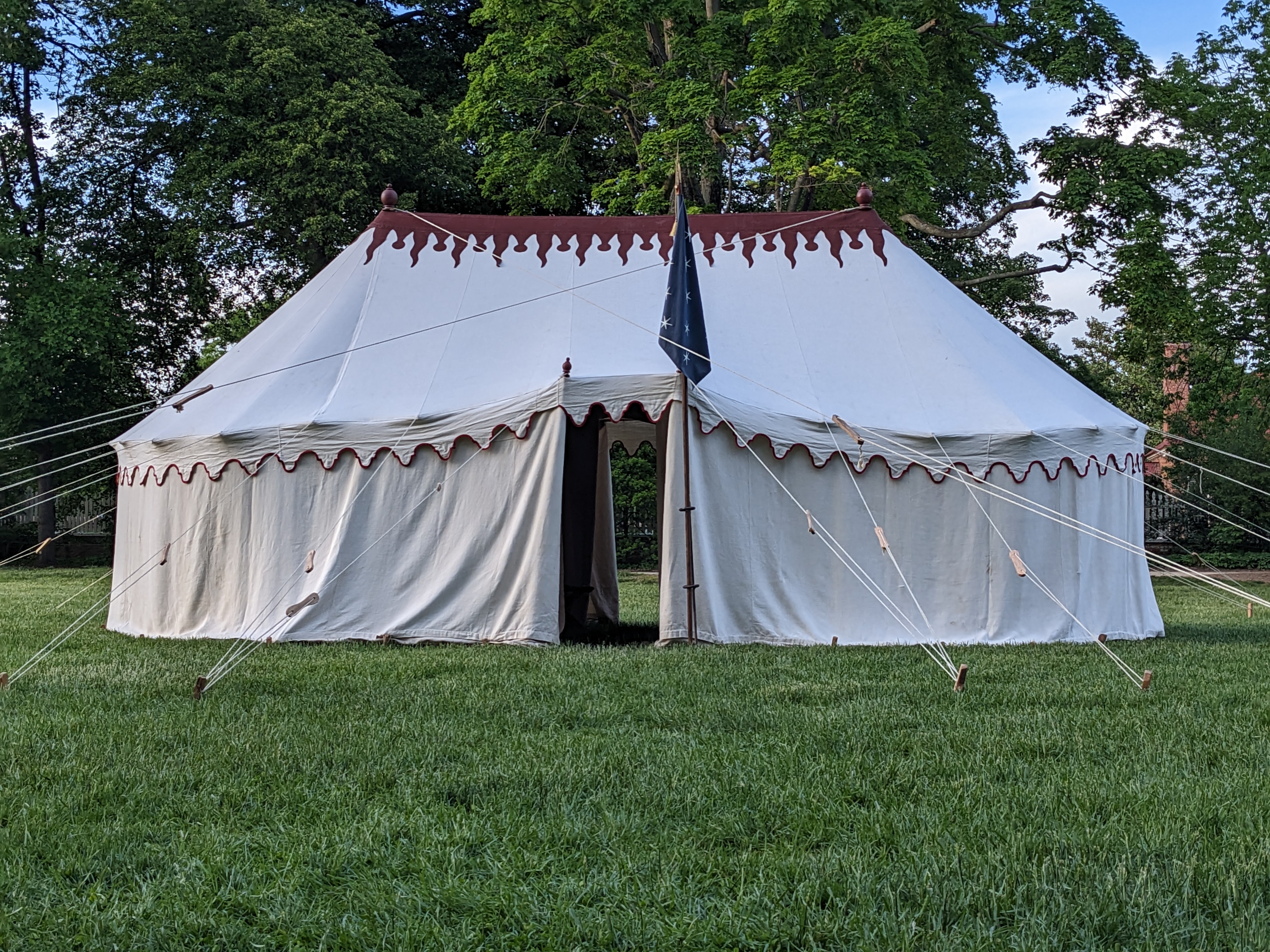 A replica of George Washington's tent stands in a grass field