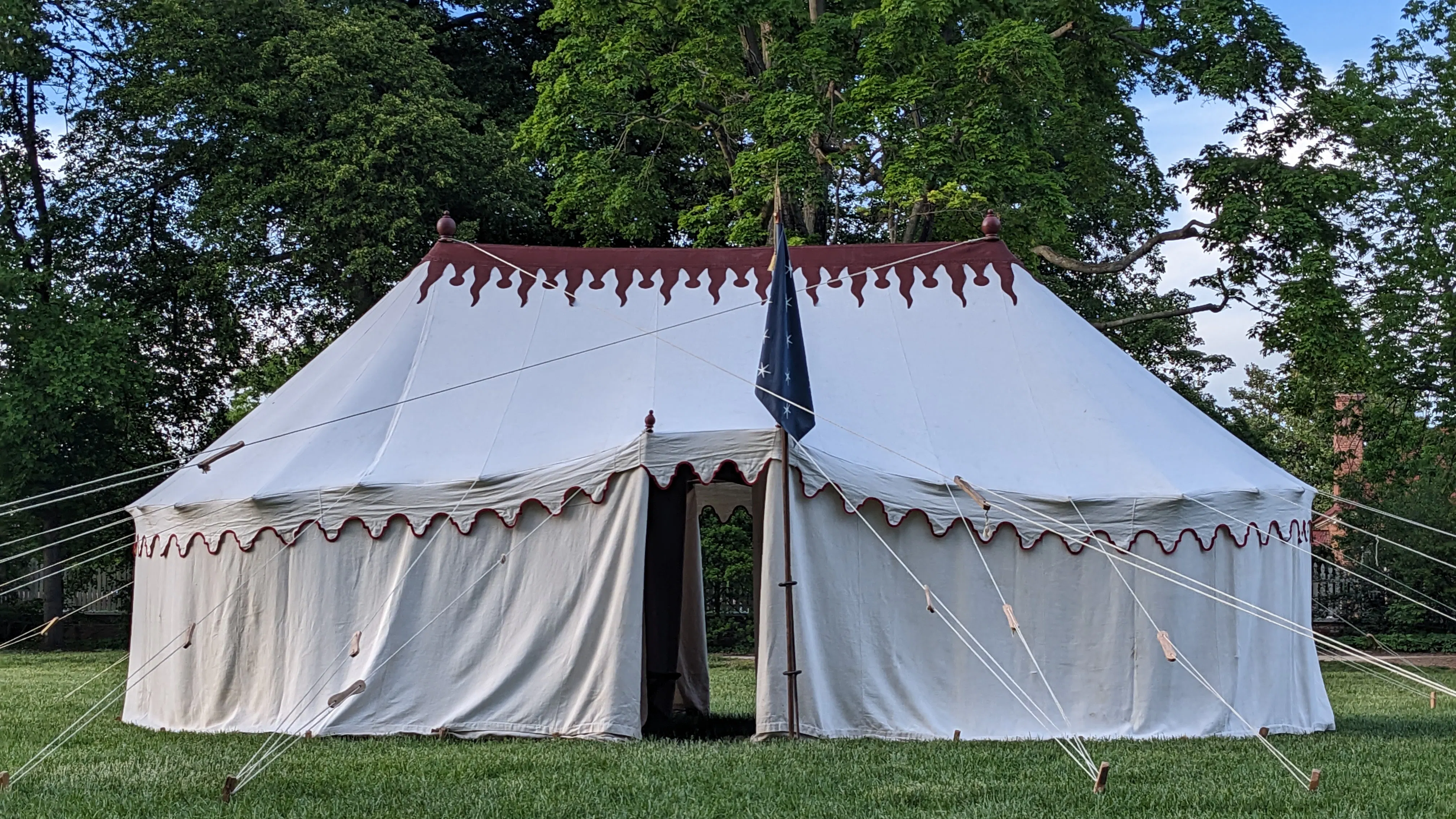 A replica of George Washington's tent stands in a grass field