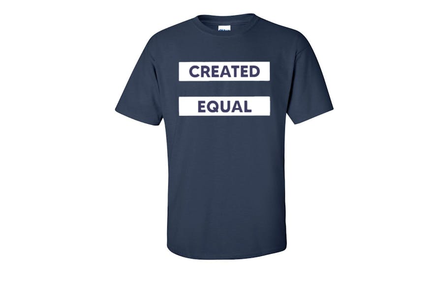 A navy blue t-shirt with two white horizontal bars in which the words created equal are.