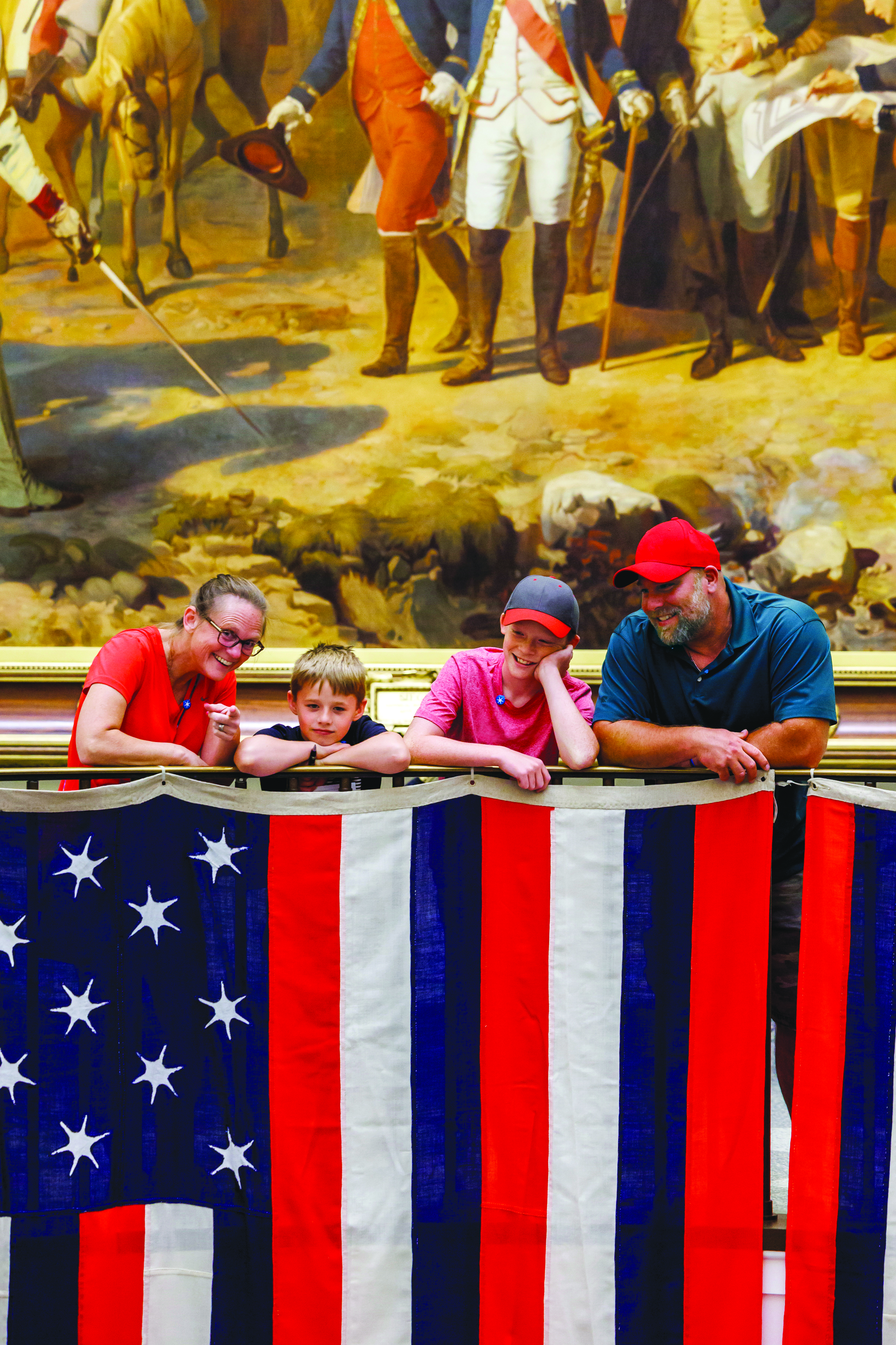 Annual Report Cover Photo of family looking at the True Colours flags.