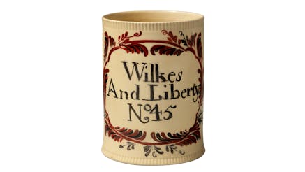 A large creamware mug featuring the words wilkes and liberty no 45.