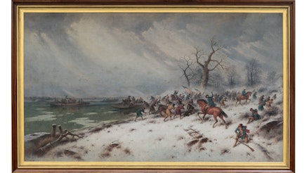 This image shows a painting depicting George Washington Crossing the Delaware. It is displayed in a brown frame with a gold interior. The painting shows Washington and his soldiers on the shores of the river. Some are still on land and some boats are already on the water. It is a snowy, gray day.