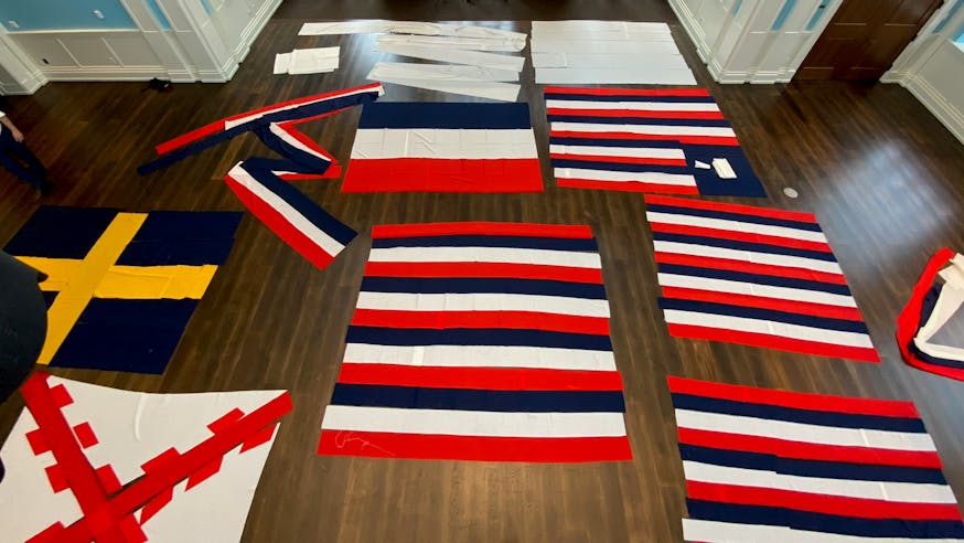 True Colours Flags laid out in liberty Hall at the Museum and photographed above from a lift