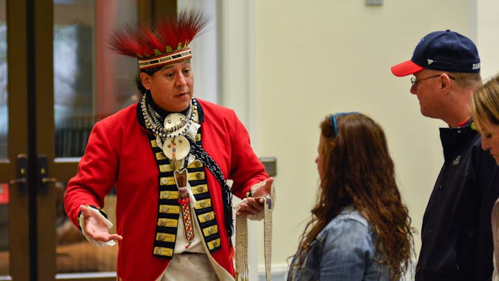 Jordan Smith dresses in traditional Mohawk clothing at the Museum as part of Indigenous Peoples Weekend in 2022.