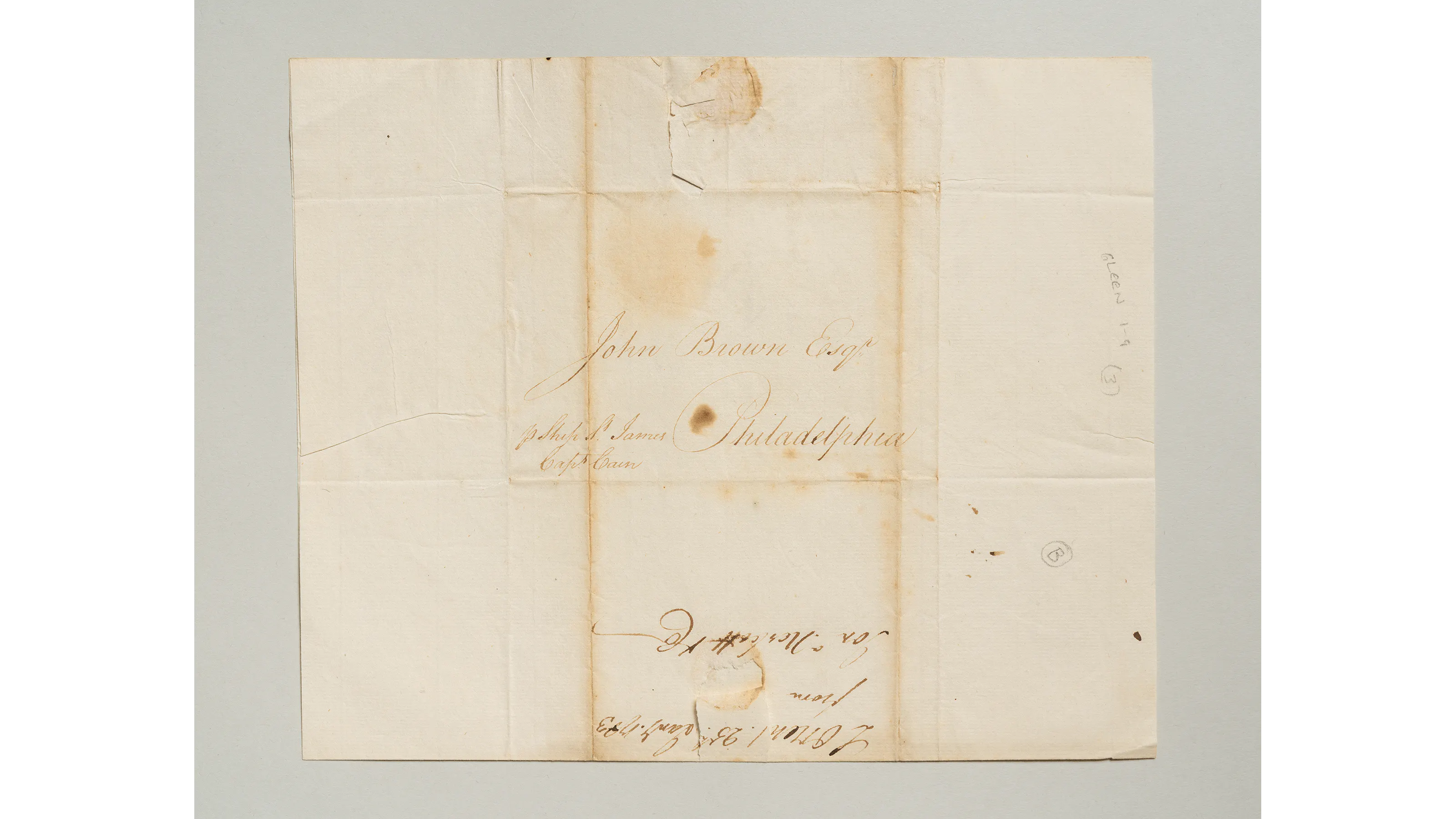 Image shows the reverse side of a handwritten letter on aging beige paper sending along news about the Articles of Peace being signed.