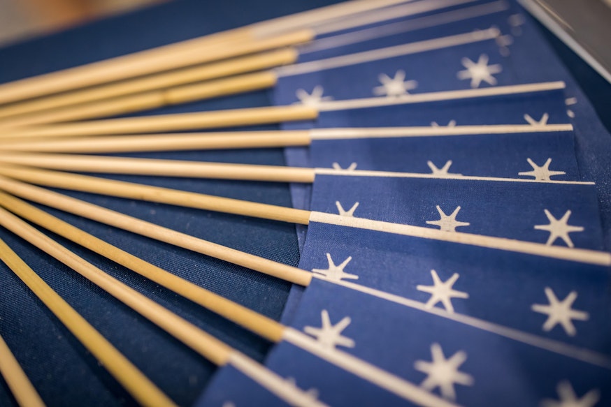 blue and white miniature versions of Washington's standard flag given away to guests