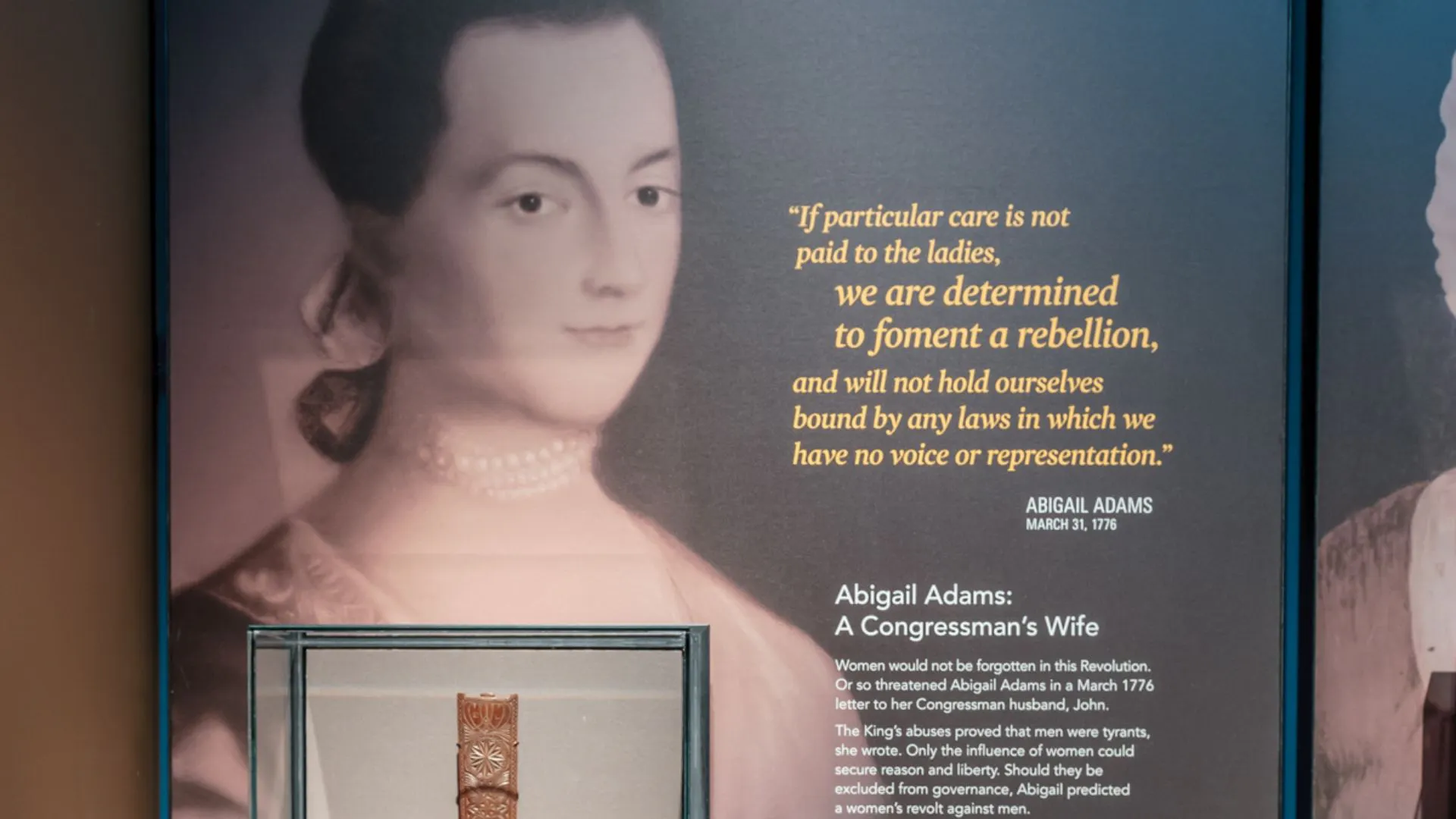 A wall in the Museum featuring a portrait and quote from Abigail Adams