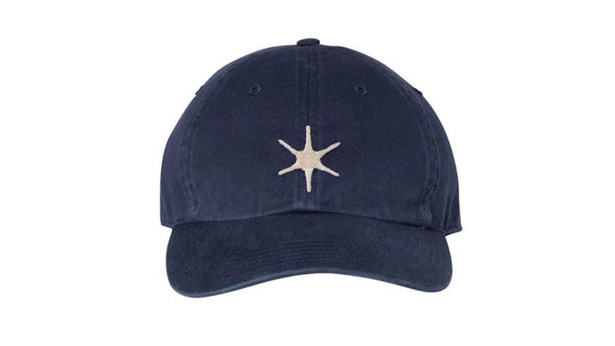 A navy blue cap with an embroidered white six-pointed star