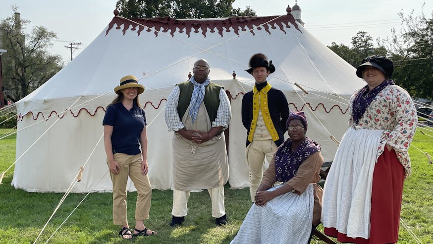 The Museum's first oval office project set up at Newport Historical Society with four costumed living history interpreters and one Museum staff member in a navy blue museum polo.
