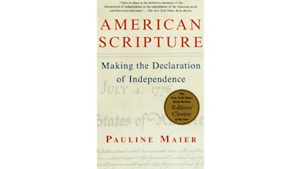 This image depicts the book cover of American Scripture: Making the Declaration of Independence by Pauline Maier. The cover is white. The American Scripture text and the author’s name are written in red. The Making the Declaration text is written in blue. And the top lines of the Declaration are written in a faded font with July 4, 1776, and United States of America being clearly visible.