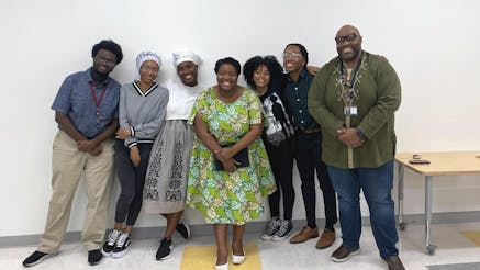 Living History Youth Summer Institute students meet with public historian Cheyney McKnight at center.